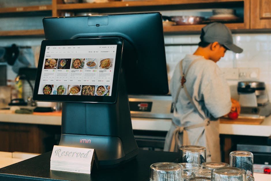 Restaurant kitchen display screen showing active orders